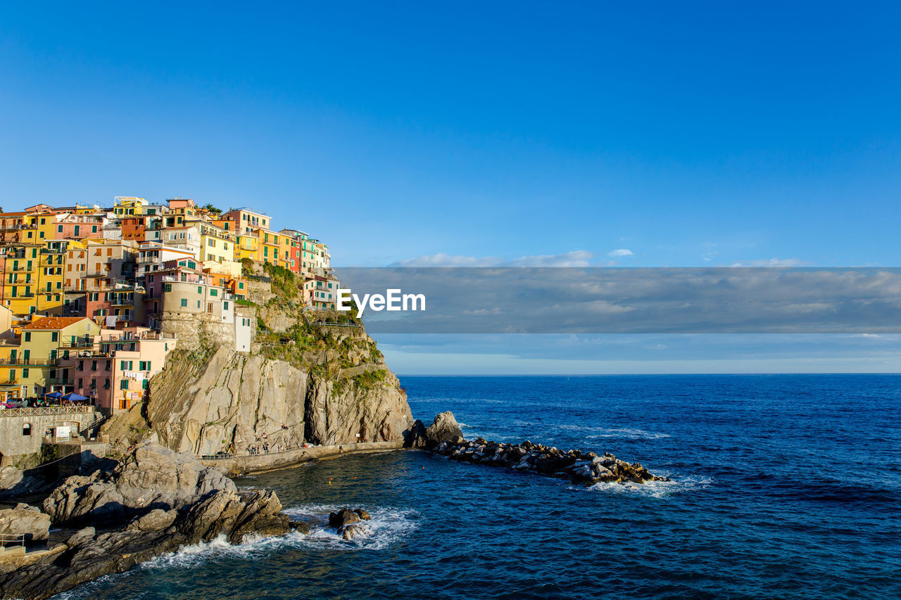 Scenic view of cinque terre against sky