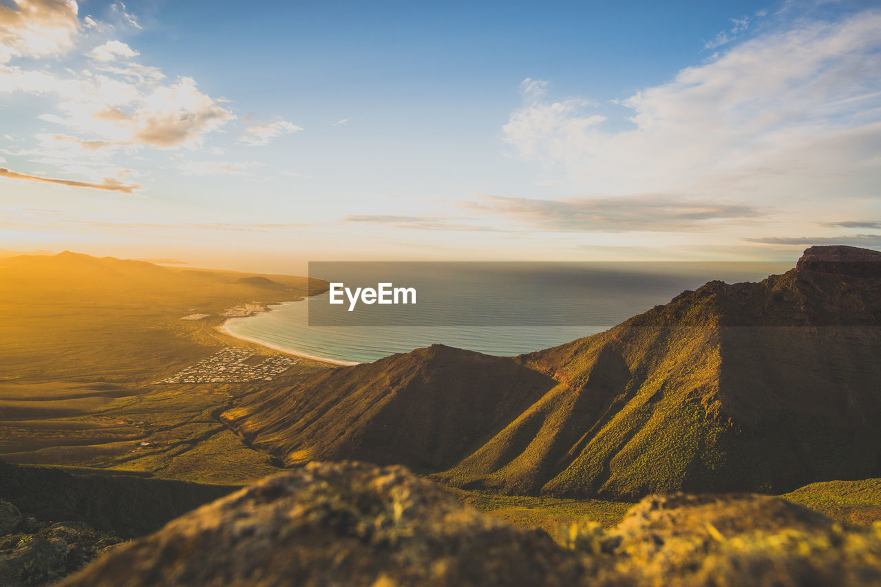 Scenic view of sea against cloudy sky