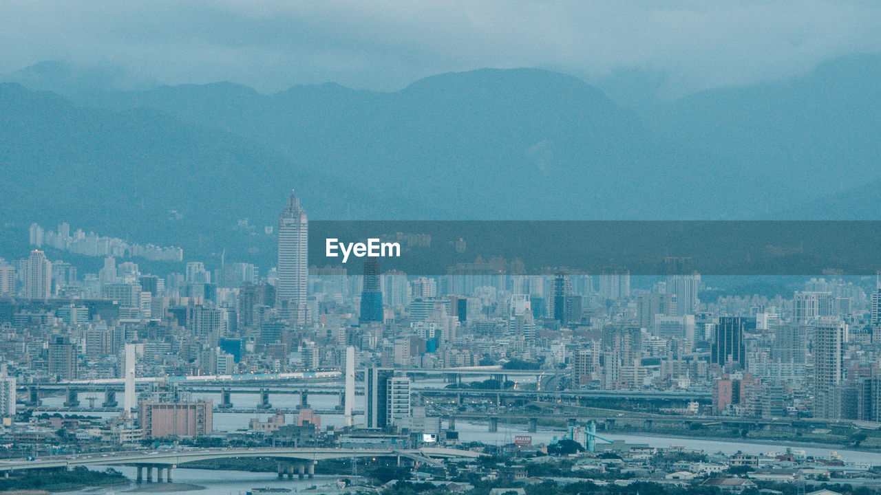 Aerial view of cityscape against sky