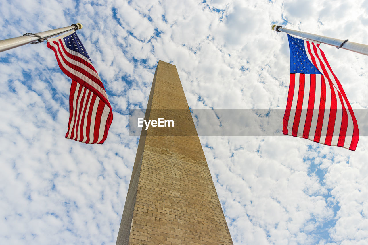 LOW ANGLE VIEW OF FLAG AGAINST BLUE SKY