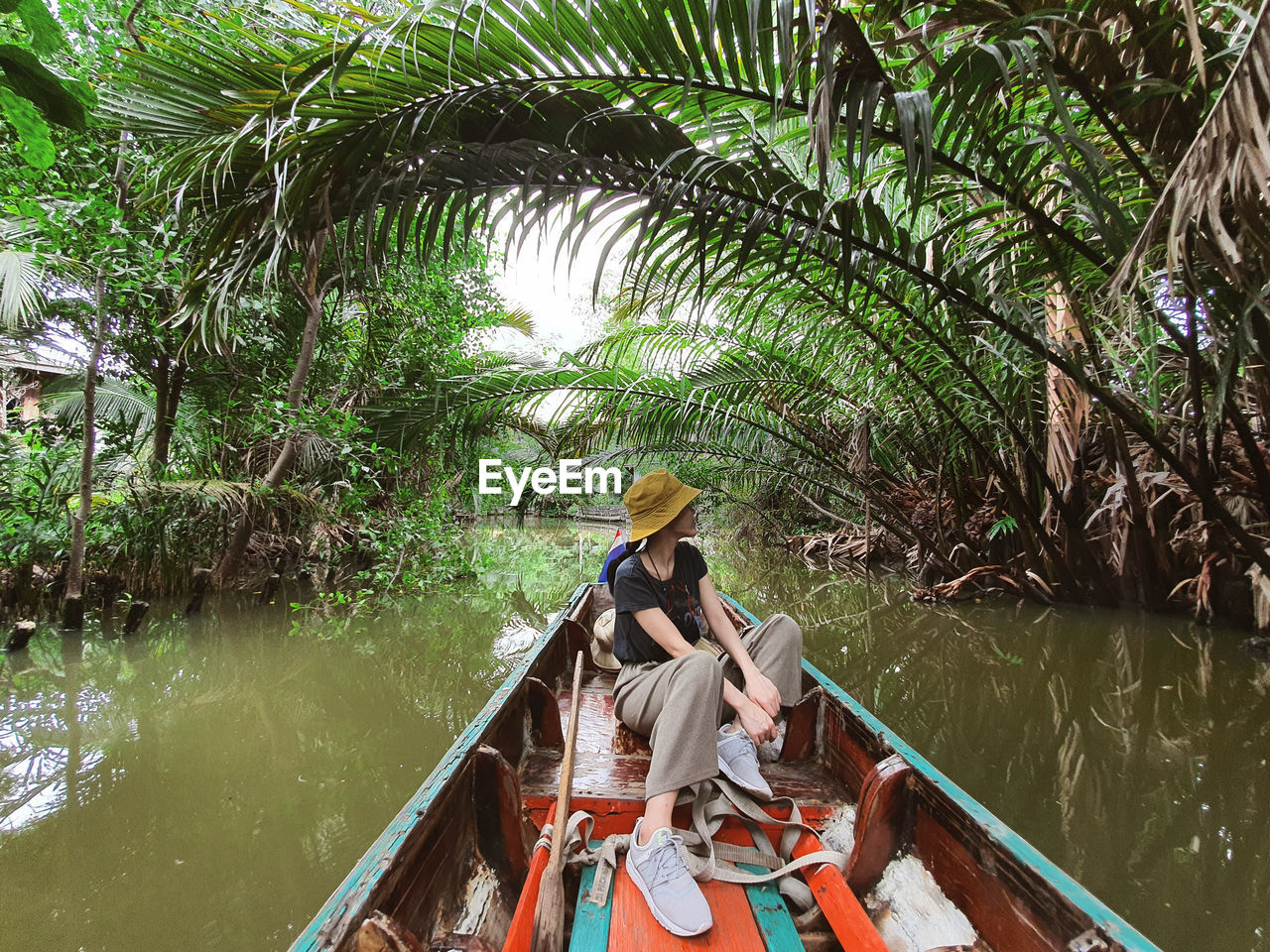 PEOPLE ON BOAT IN RIVER