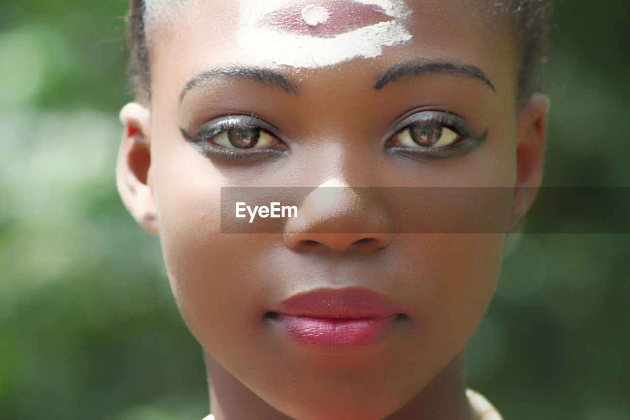 Close-up portrait of woman wearing make-up