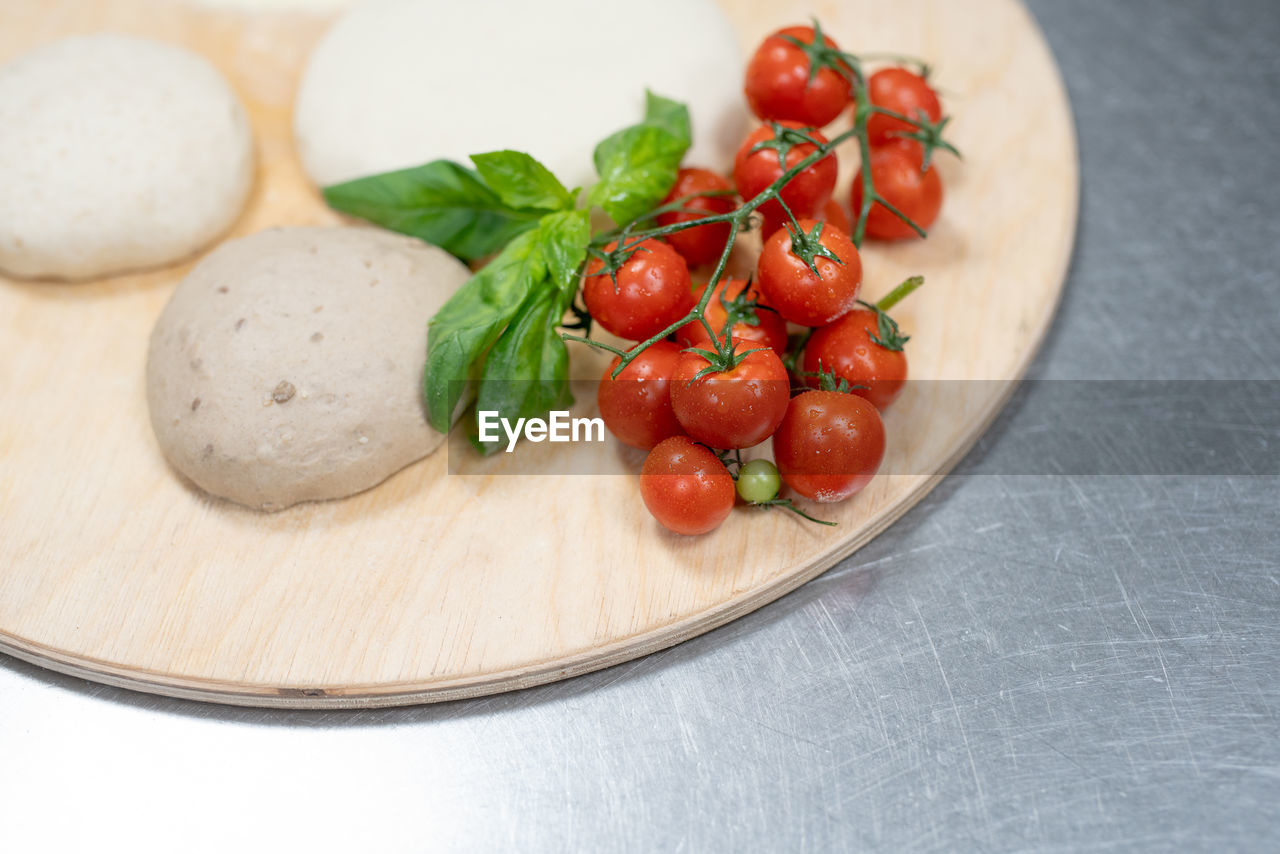 Close-up of cherry tomatoes in plate on table