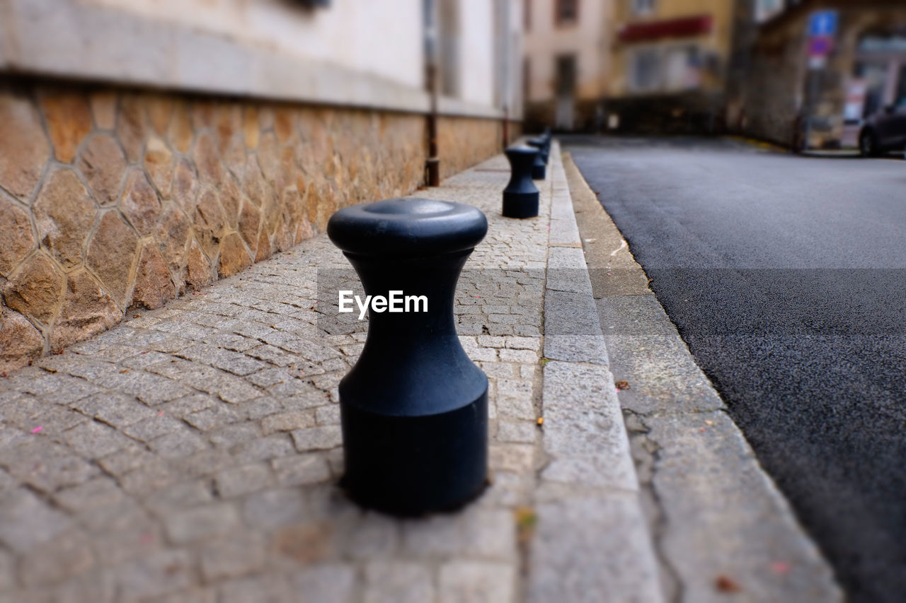 CLOSE-UP OF CHESS PIECES ON STREET