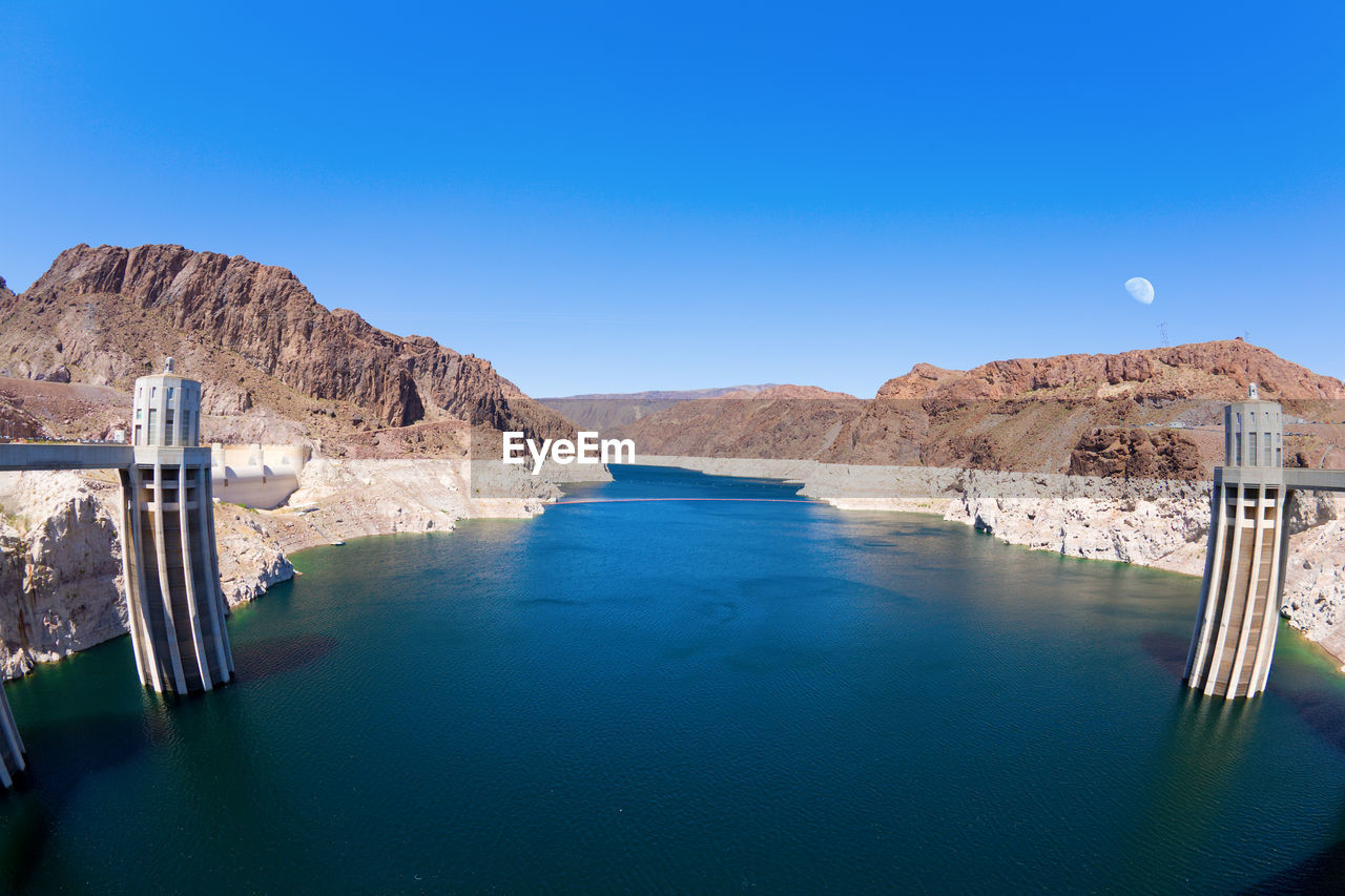 PANORAMIC VIEW OF LAKE AGAINST CLEAR BLUE SKY