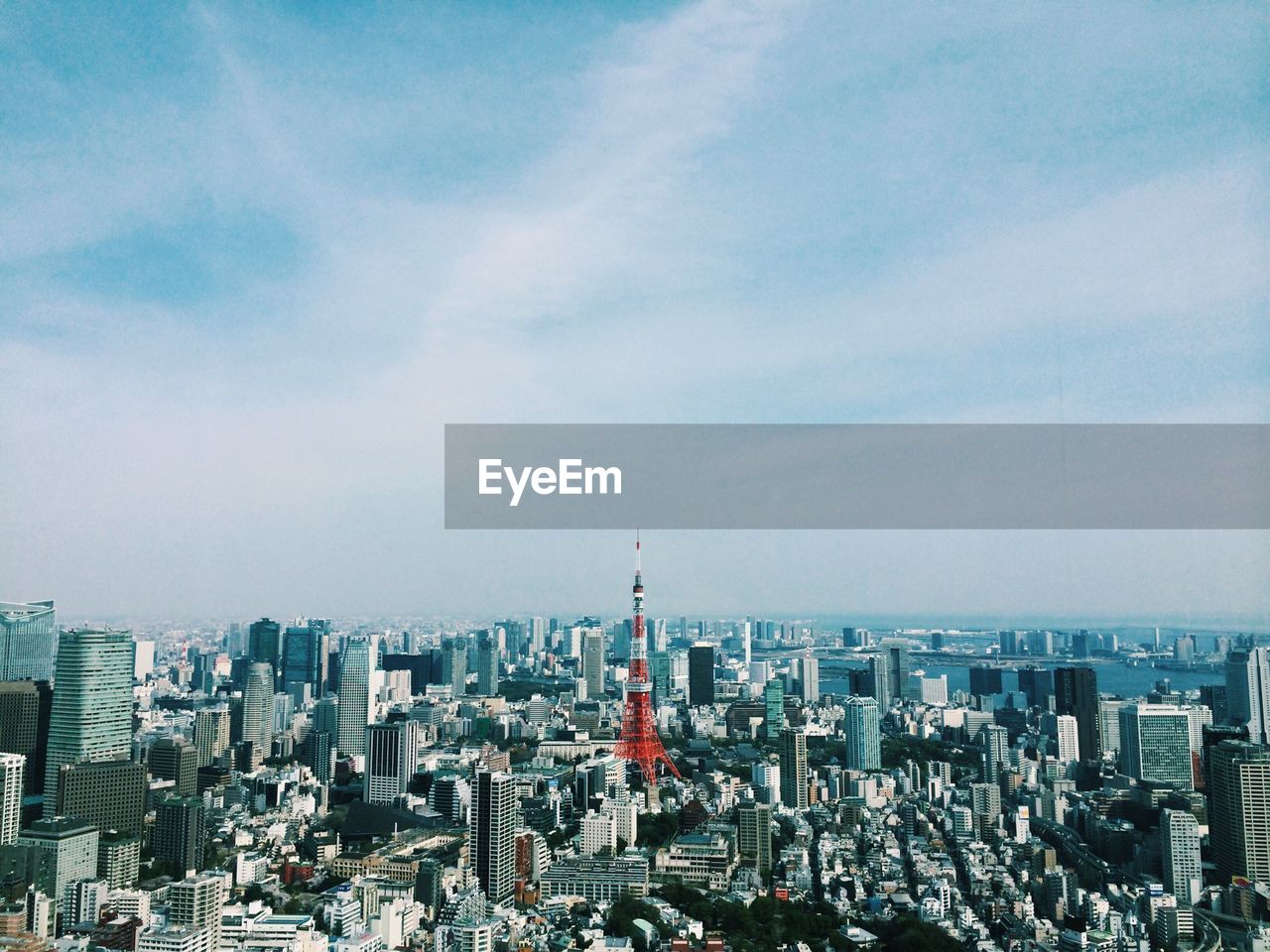 Tokyo cityscape against cloudy sky