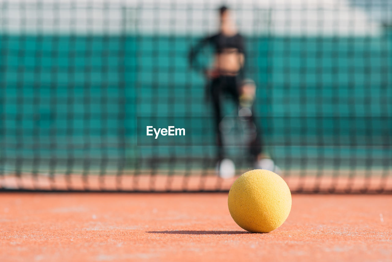 Woman playing tennis in court