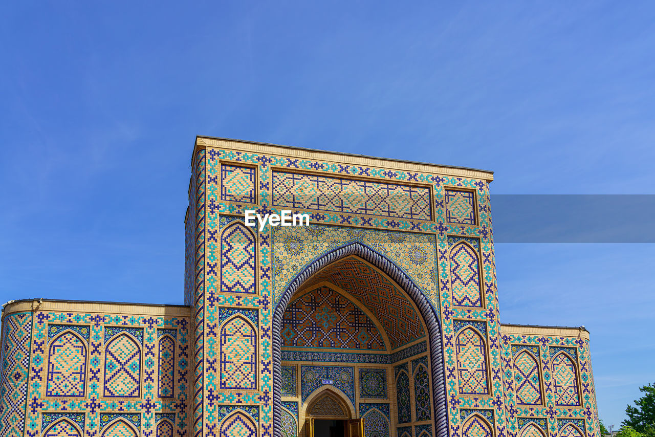 low angle view of building against blue sky