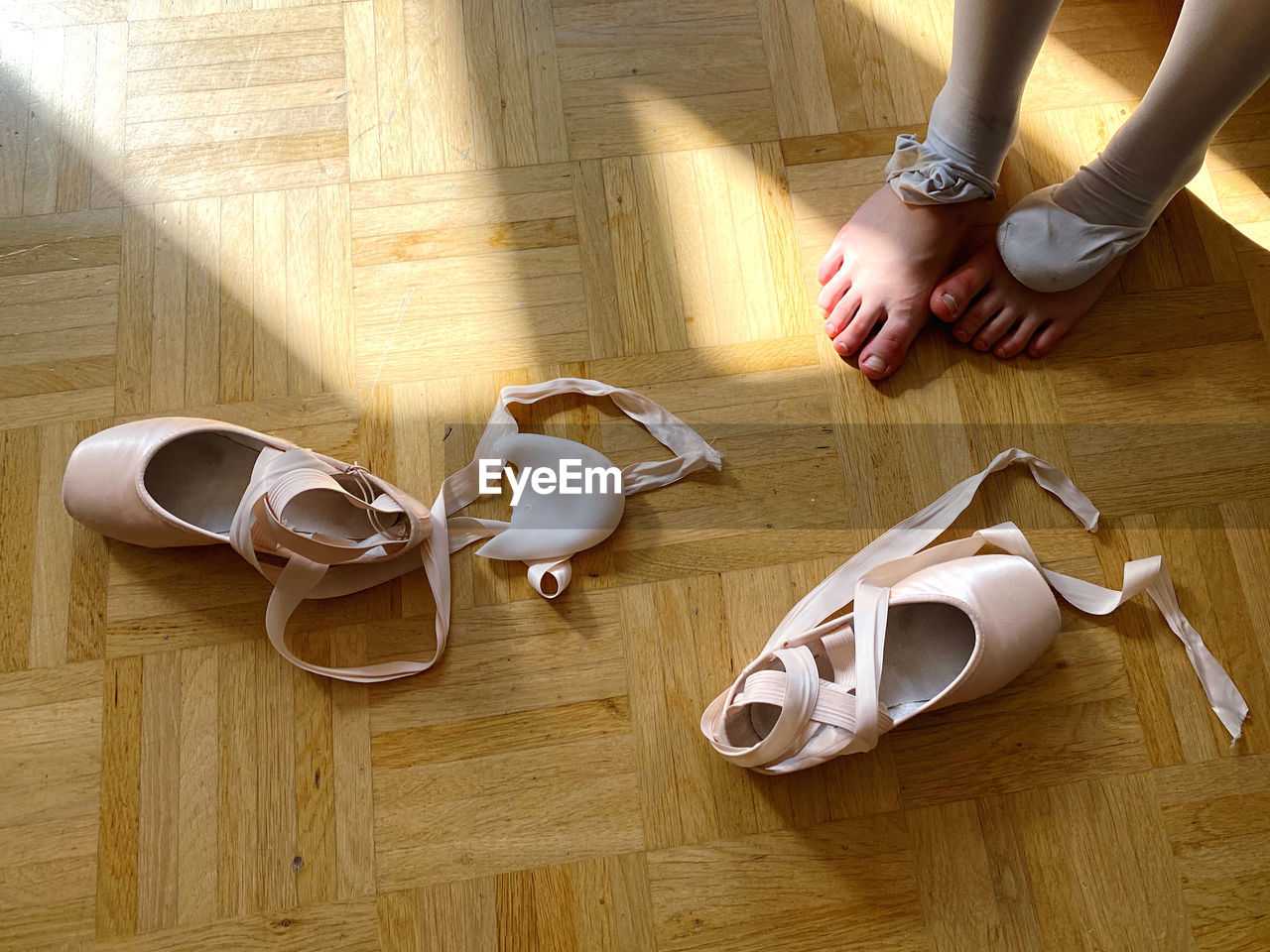 High angle view of girls foot after ballet class