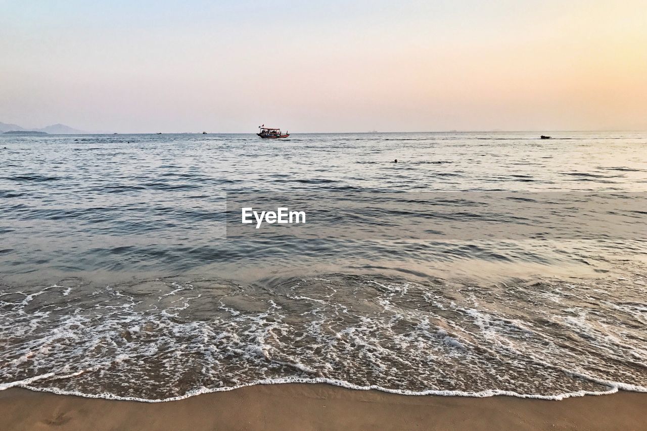 SCENIC VIEW OF BEACH AGAINST CLEAR SKY