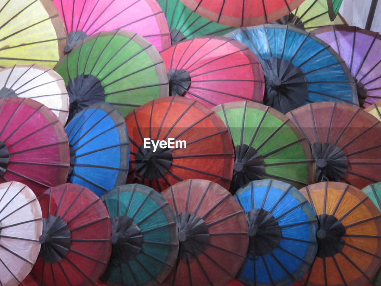 Full frame shot of colorful paper umbrellas at market stall