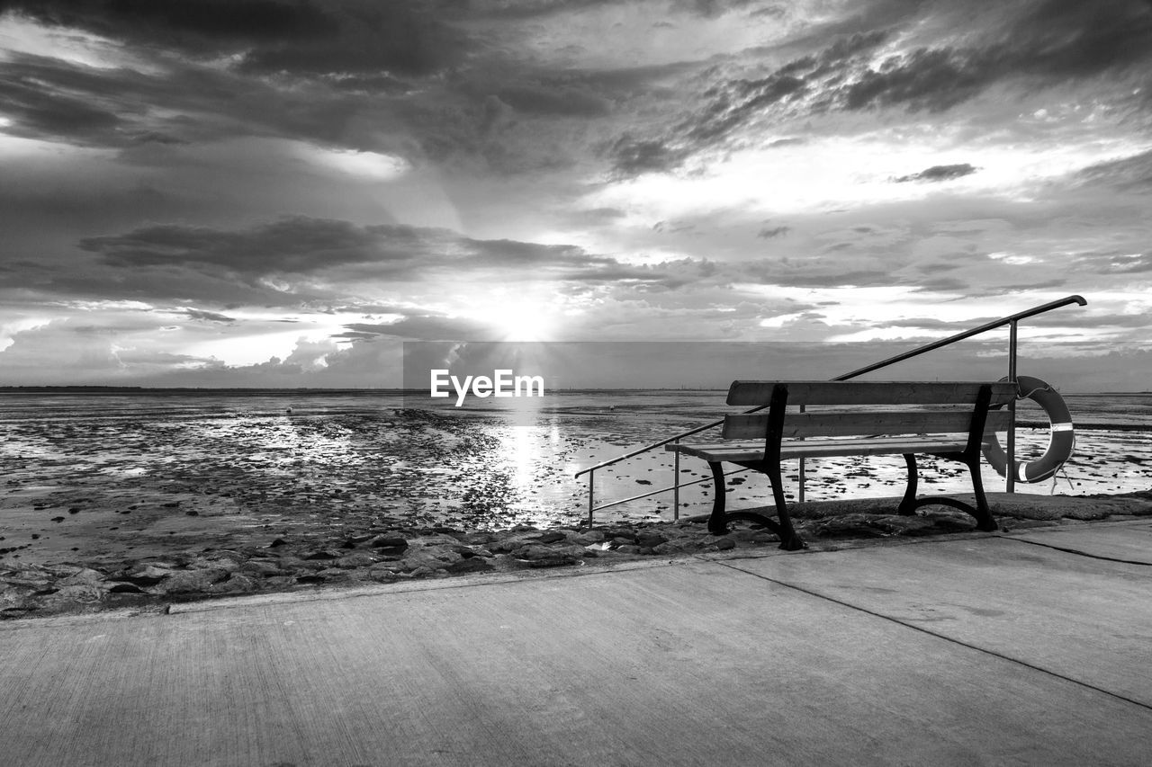 Scenic view of beach against sky during sunset