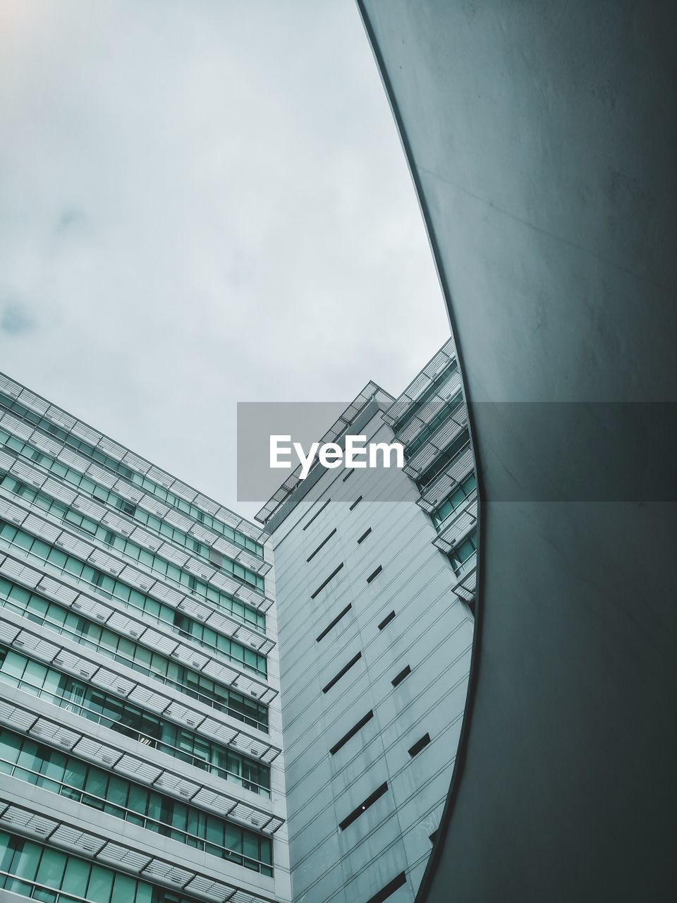 Low angle view of modern buildings against sky