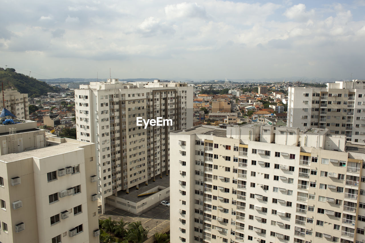 High angle view of buildings in city against sky