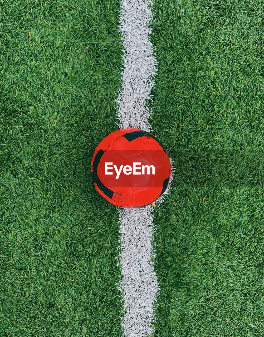 High angle view of football on grassy field