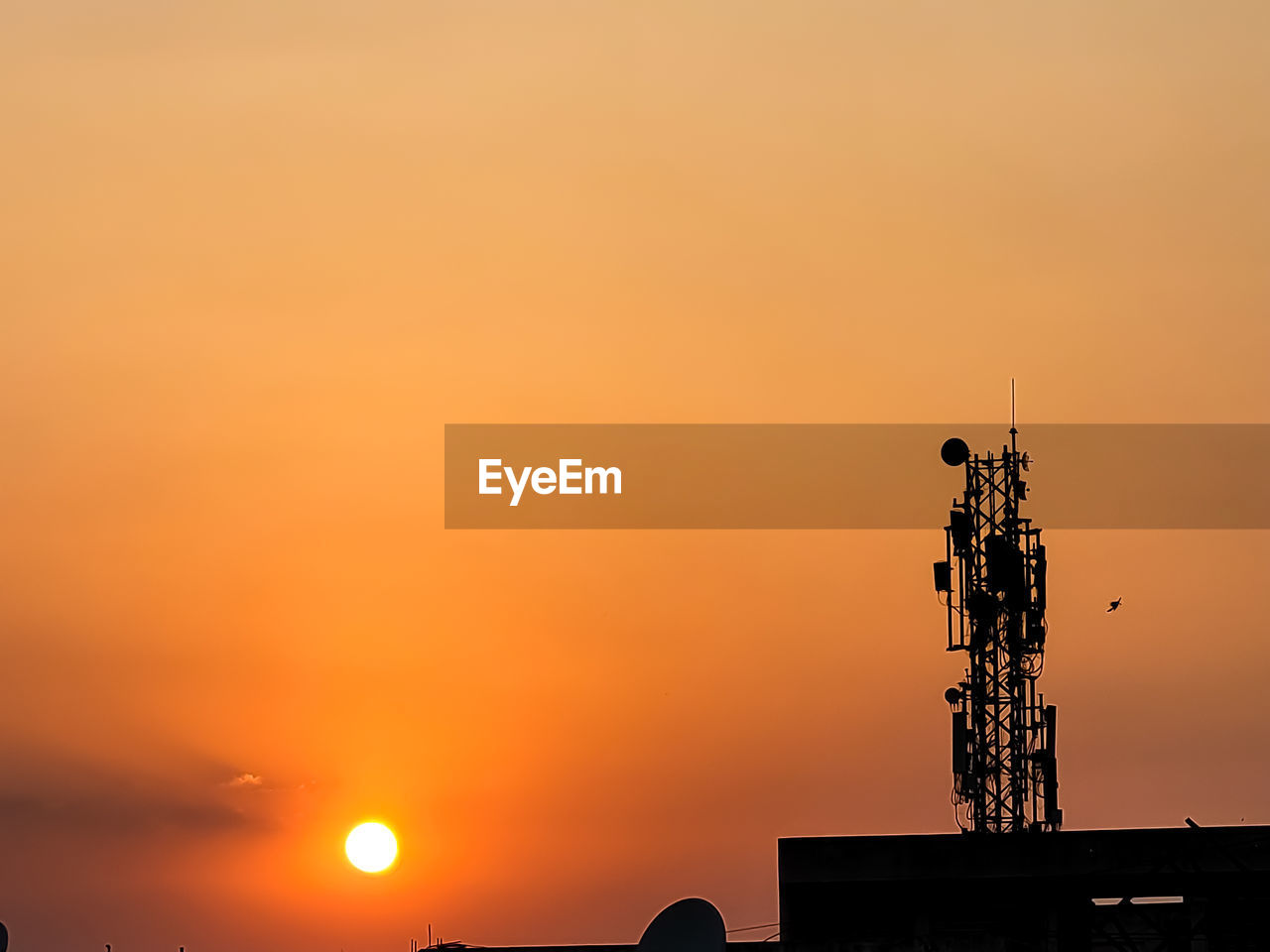 sunset, sky, horizon, orange color, silhouette, architecture, afterglow, dawn, built structure, evening, nature, technology, sun, copy space, no people, cloud, communication, communications tower, tower, beauty in nature, building exterior, outdoors, industry, skyline, scenics - nature, dramatic sky
