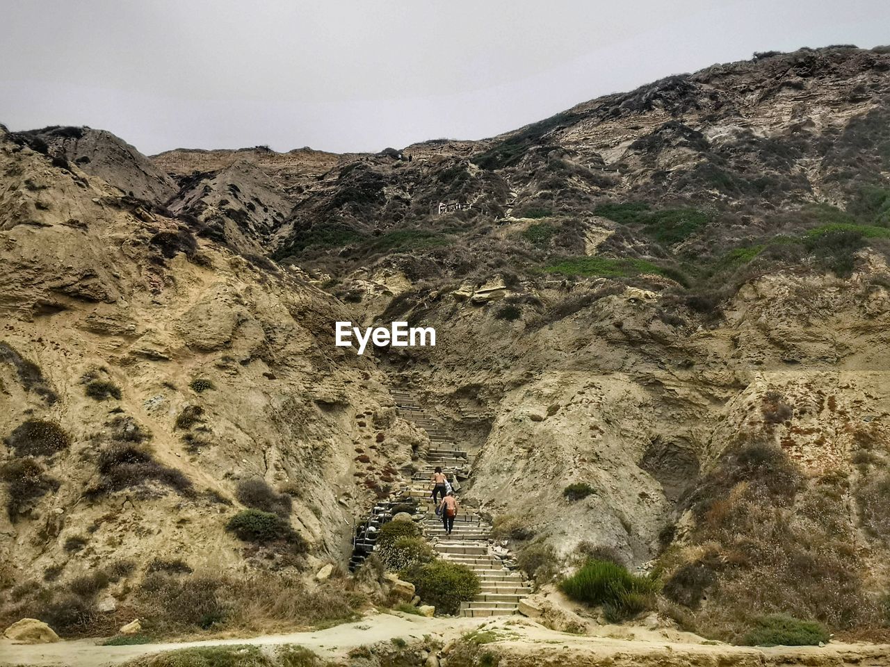 PEOPLE WALKING ON MOUNTAIN