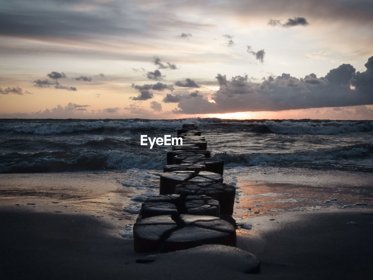 scenic view of sea at sunset