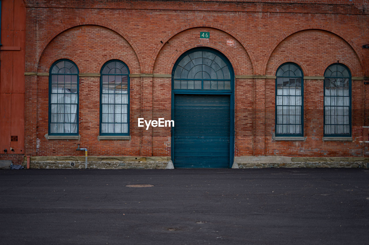 Building exterior with closed blue door