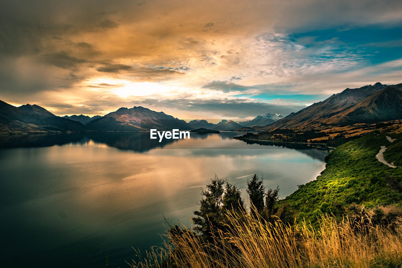 Scenic view of lake against sky during sunset