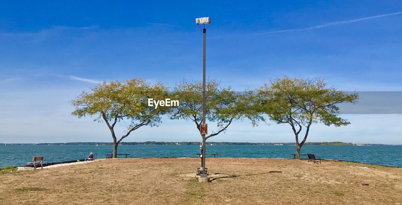 Scenic view of sea against blue sky