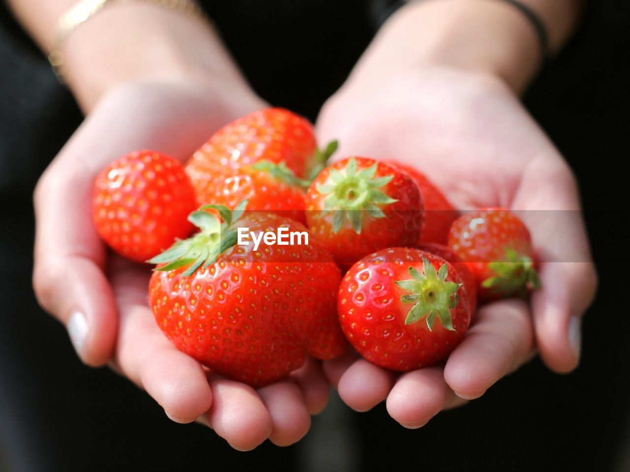 Strawberries in woman's hands