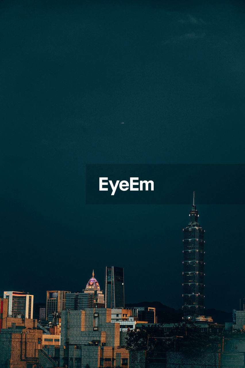 Buildings in city at night