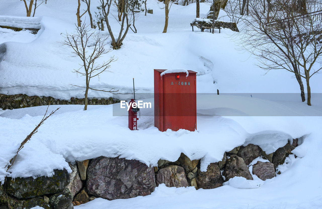 Red fire spot covered by snow, japan