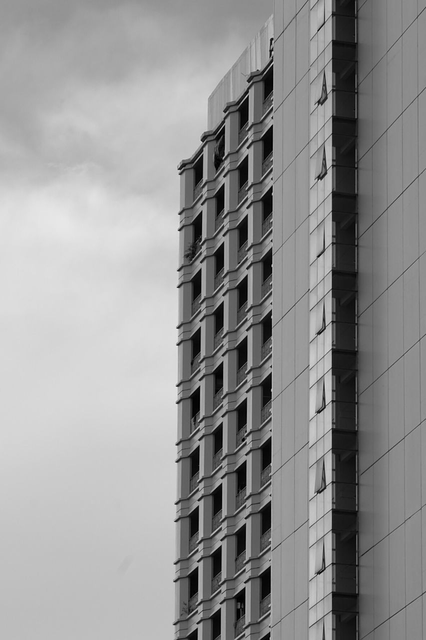 LOW ANGLE VIEW OF APARTMENT BUILDING AGAINST SKY