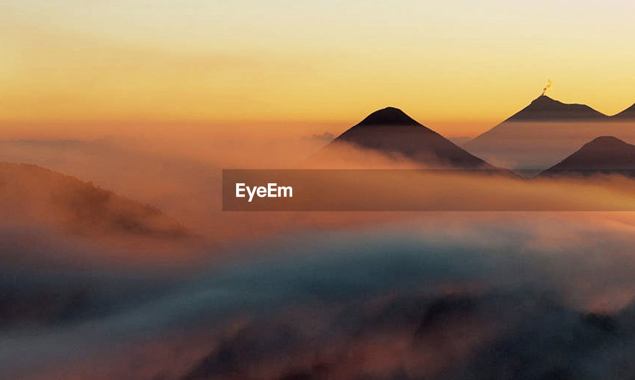 Scenic view of mountains against sky during sunset