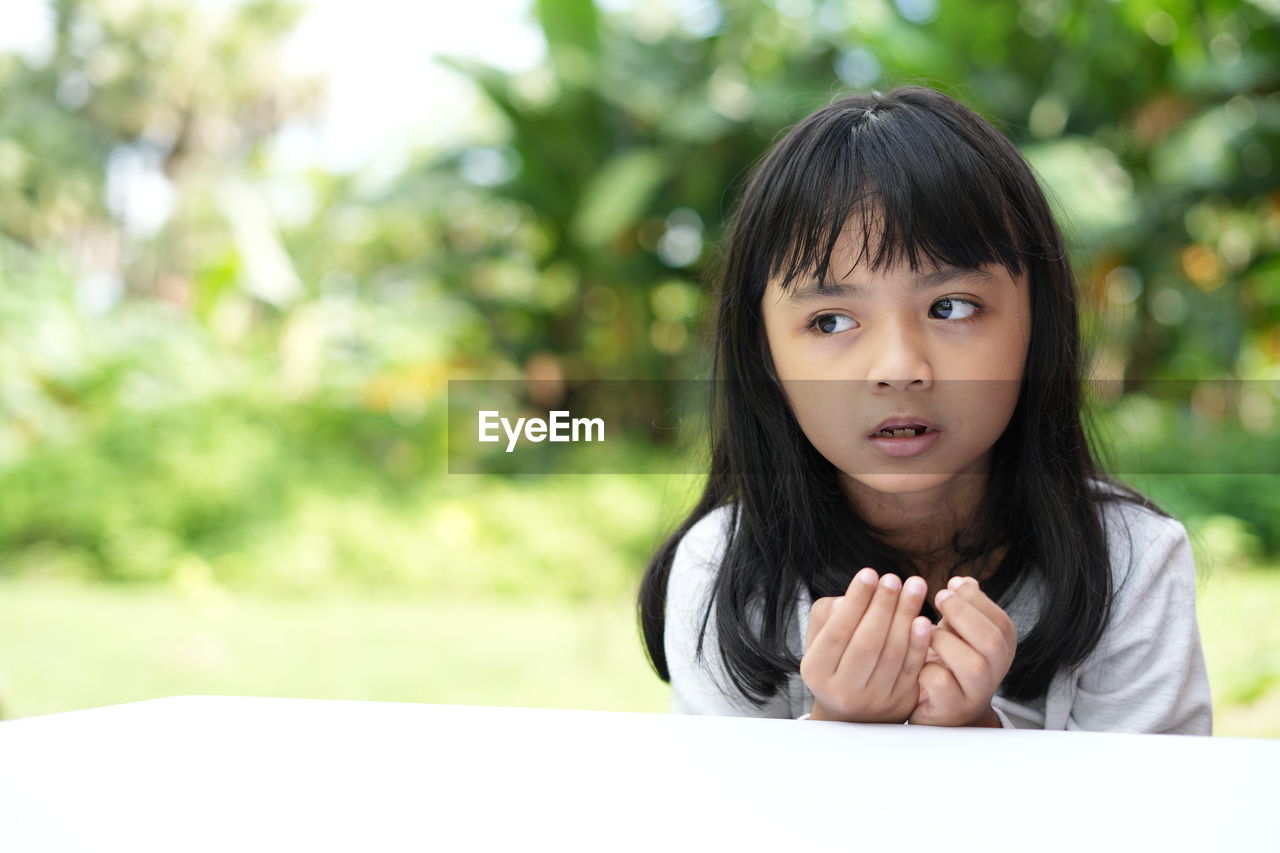 portrait of young woman looking away