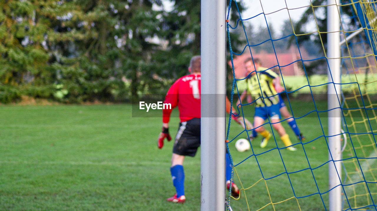 Men playing soccer