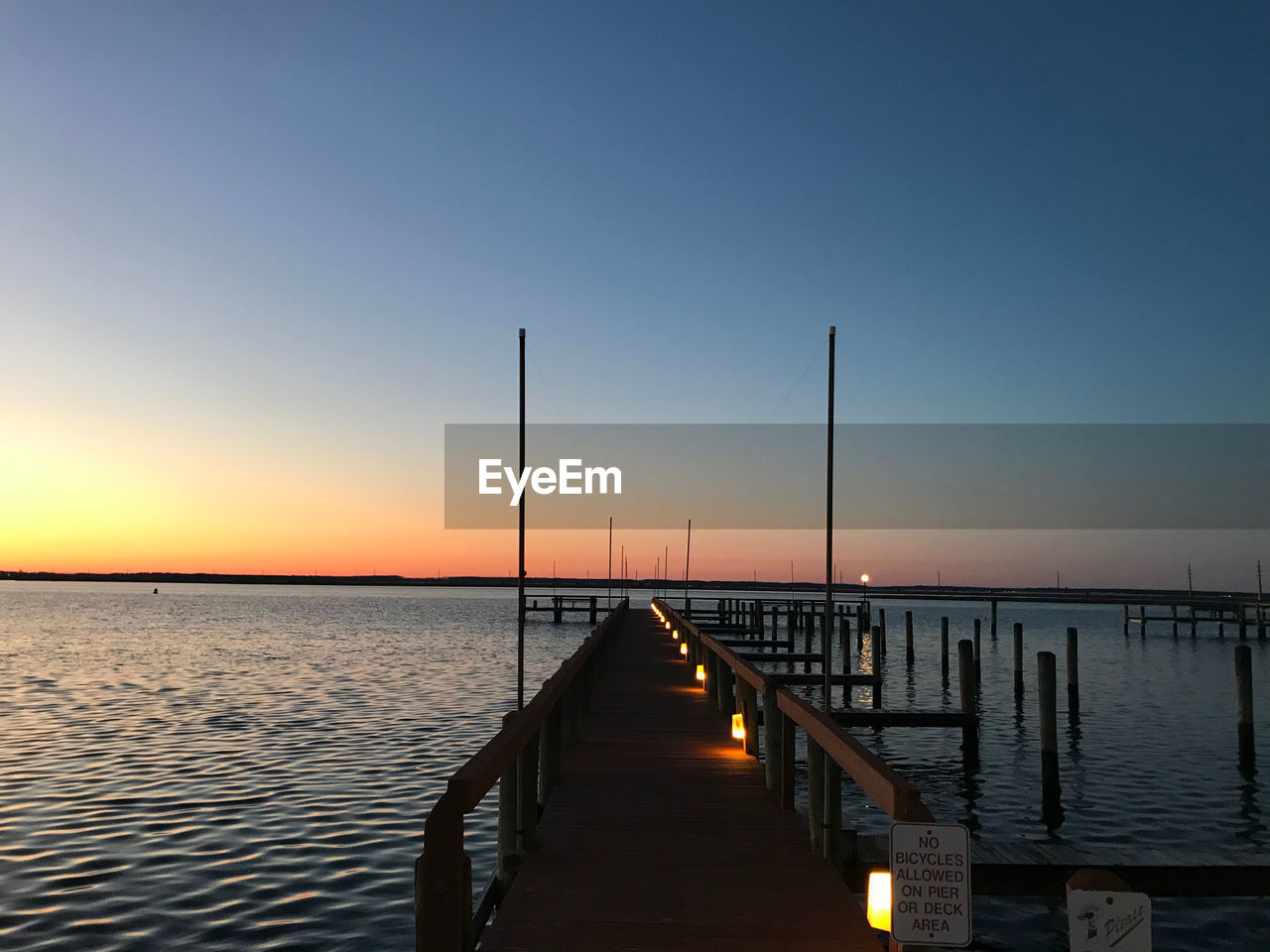 Scenic view of sea against clear sky during sunset