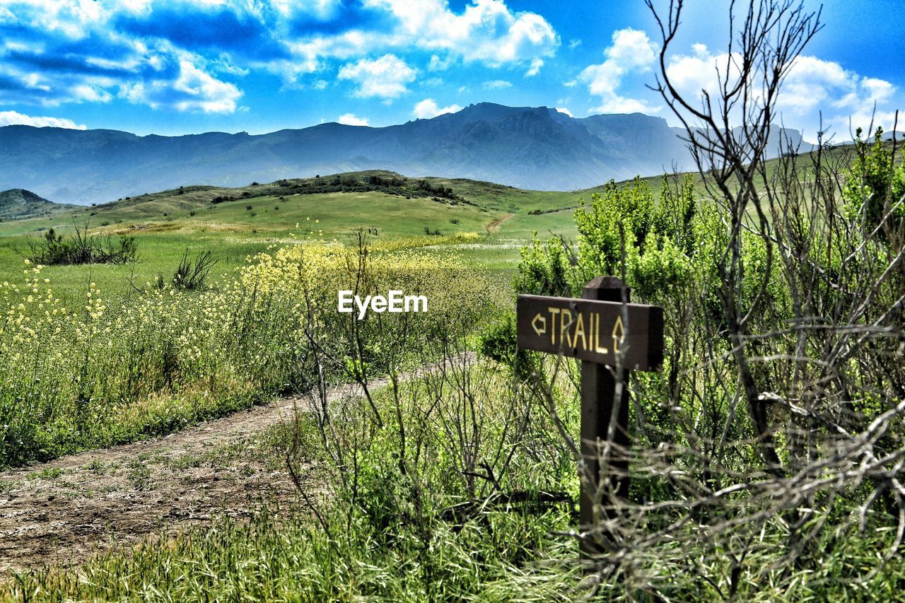 Narrow trail on countryside landscape