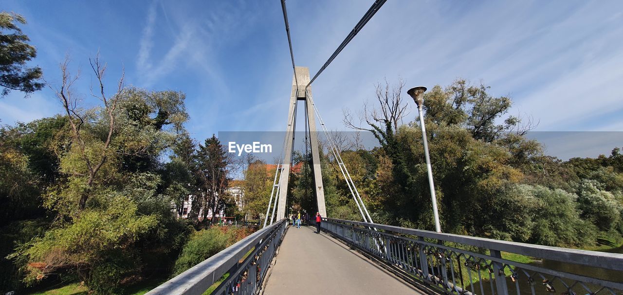 BRIDGE OVER ROAD AGAINST SKY