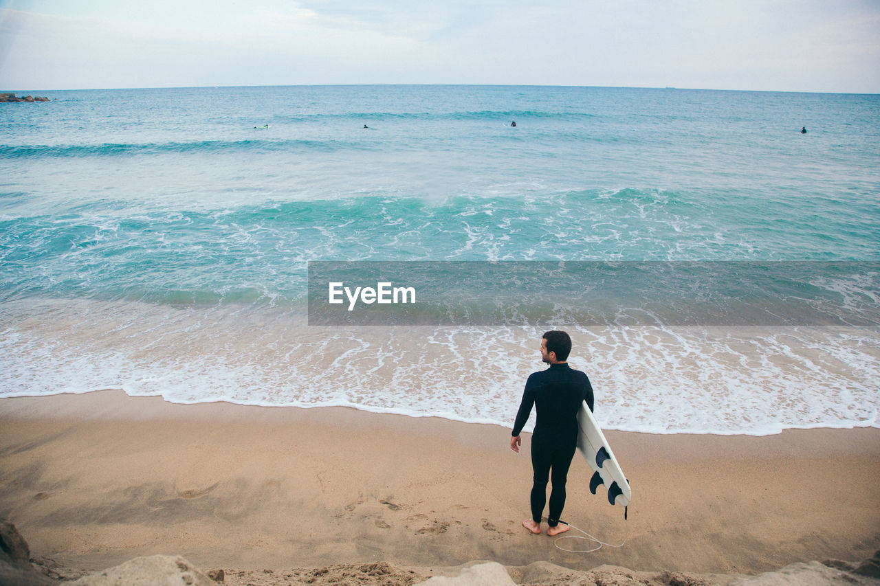 Rear view of man on beach