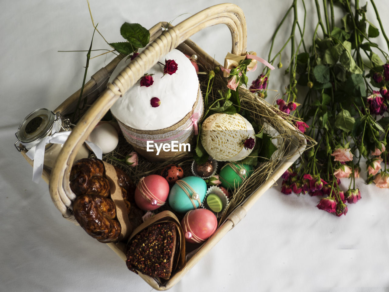 High angle view of easter basket with flowers on table