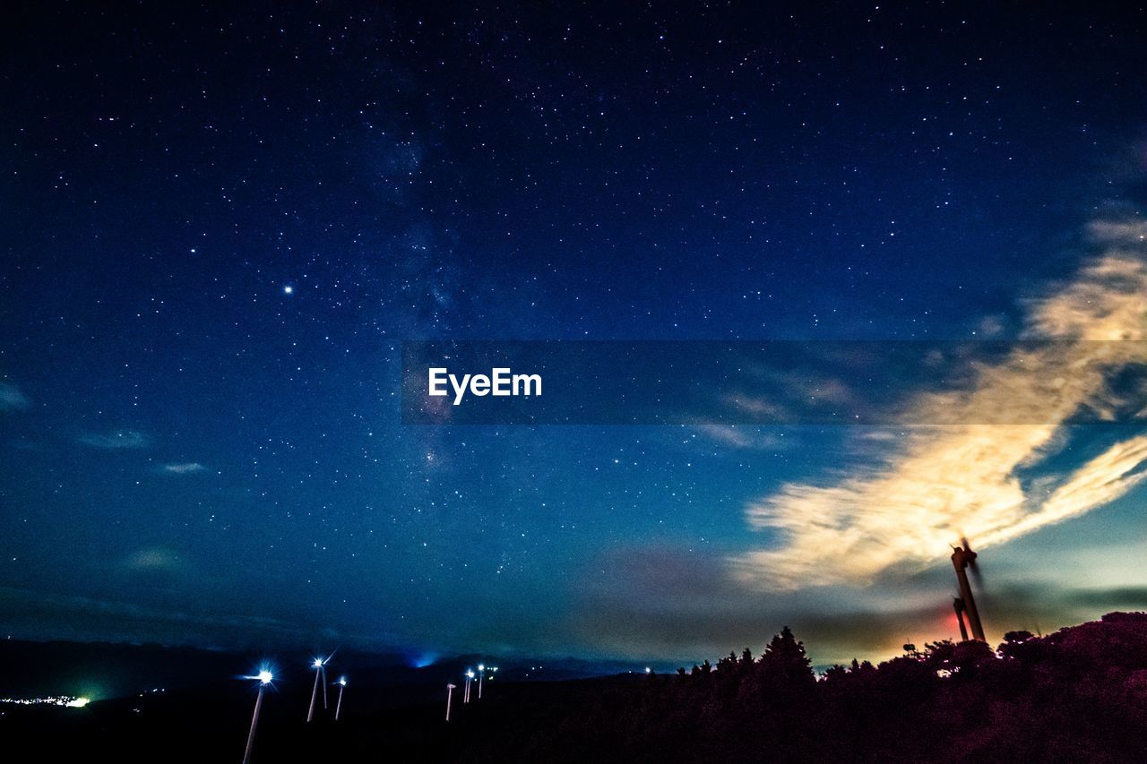 LOW ANGLE VIEW OF SILHOUETTE STARS AGAINST SKY AT NIGHT