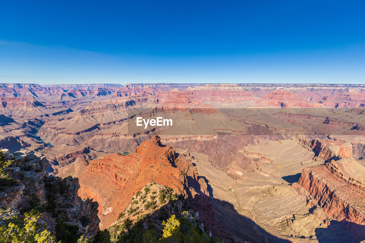 aerial view of landscape against clear blue sky