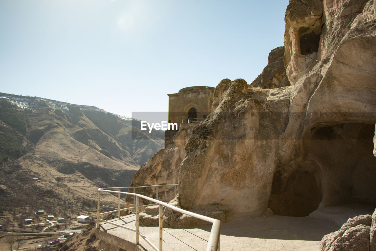 Cave city in georgia. ancient architecture. mountain landscape. summer day on road. landscape view.