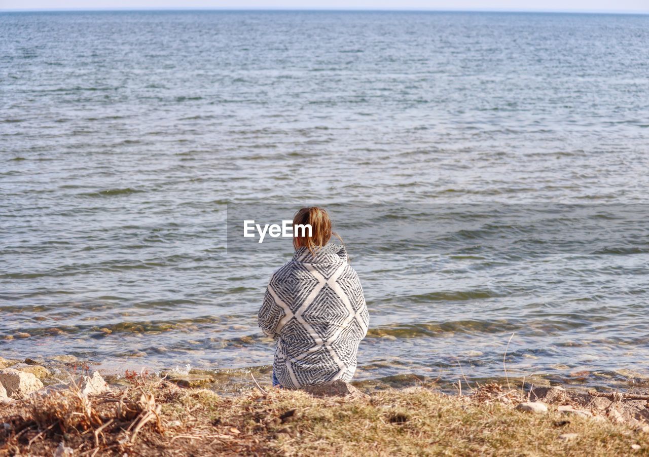 Rear view of woman looking at sea