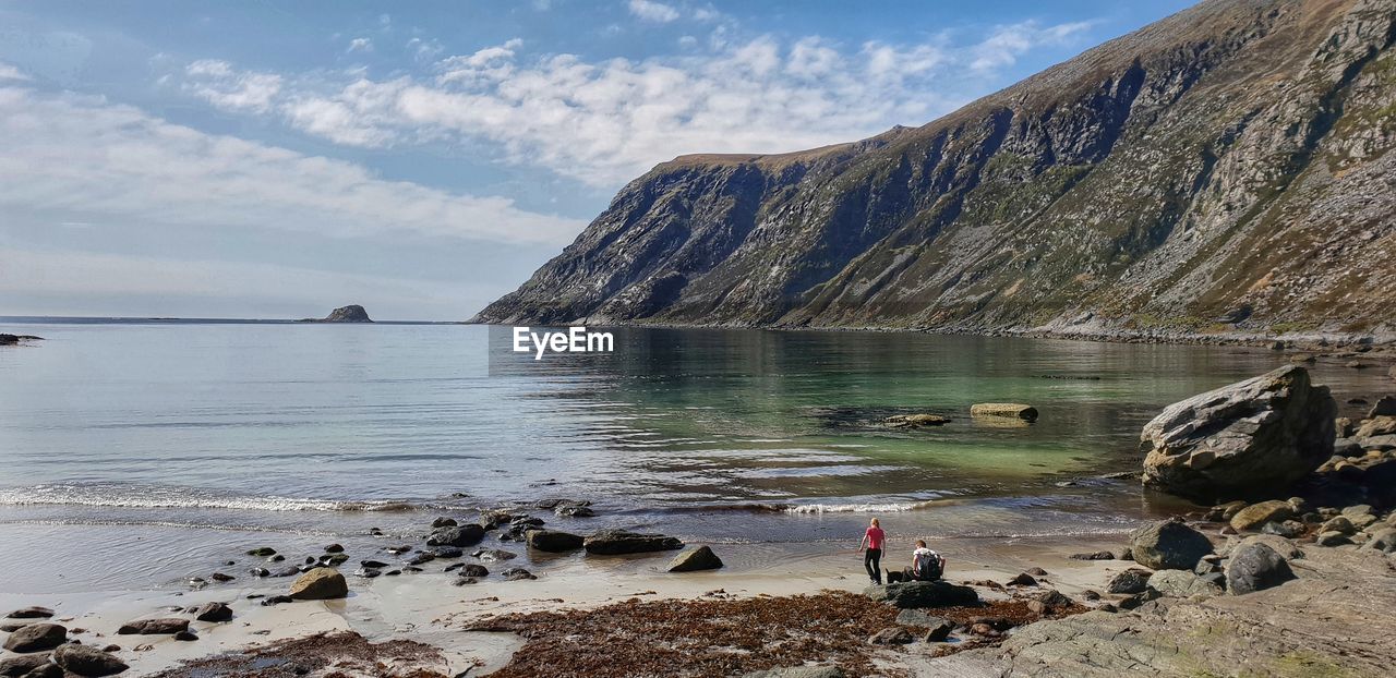 SCENIC VIEW OF SEA AND ROCKS AGAINST SKY