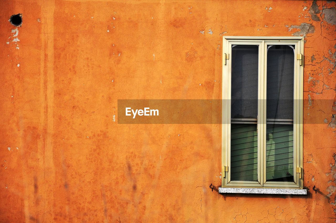 window, architecture, building exterior, built structure, wall, building, no people, wood, red, wall - building feature, residential district, house, yellow, orange color, day, old, door, outdoors, closed, interior design, full frame, window covering, backgrounds, weathered, entrance, brown