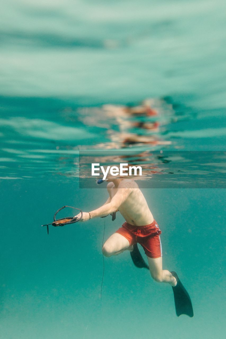 Man swimming in sea