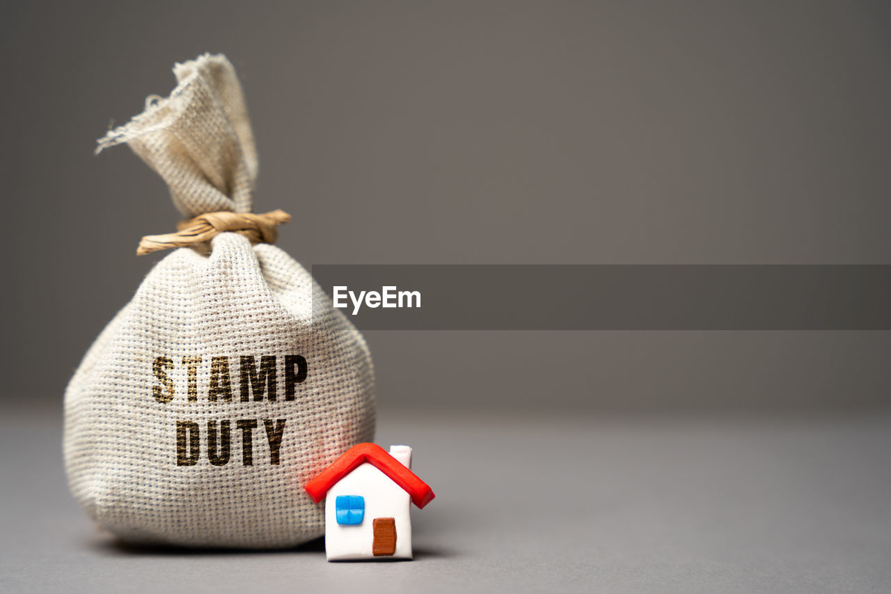 Stamp duty concept. taxes assessed during the transfer of real estate between two parties. 