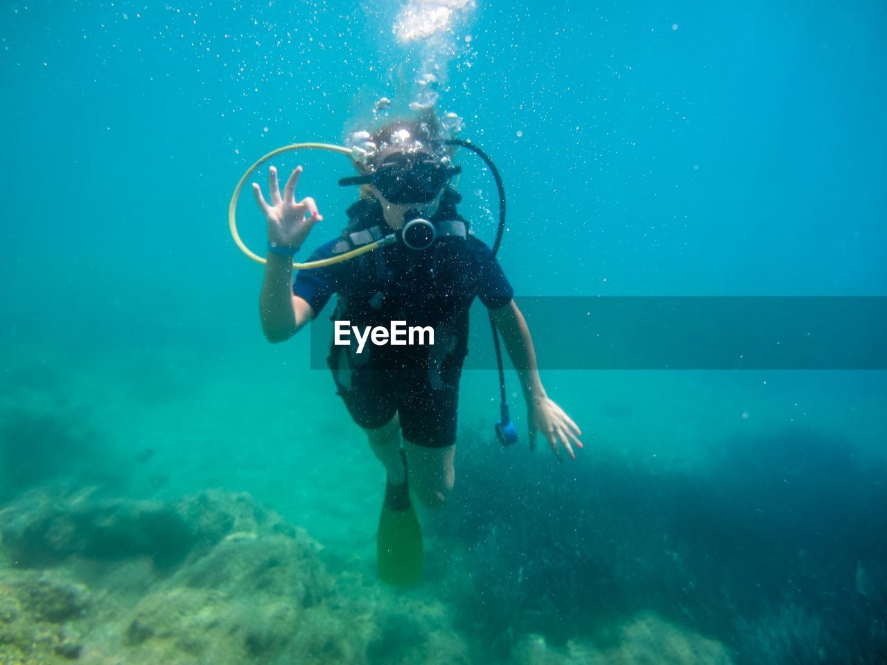 BOY SWIMMING IN SEA