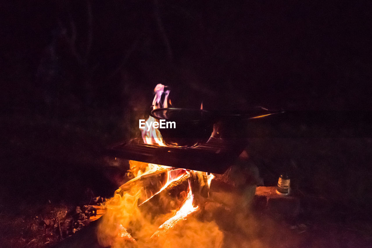 campfire, burning, fire, heat, flame, bonfire, darkness, night, nature, motion, glowing, smoke, adult, one person, outdoors, men