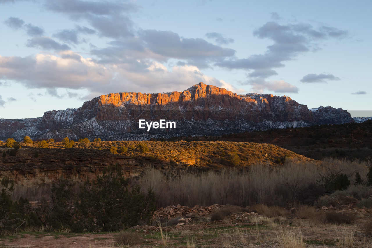 Rock formations on landscape against sky