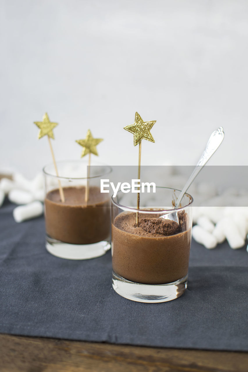 Close-up of chocolates in glasses on table