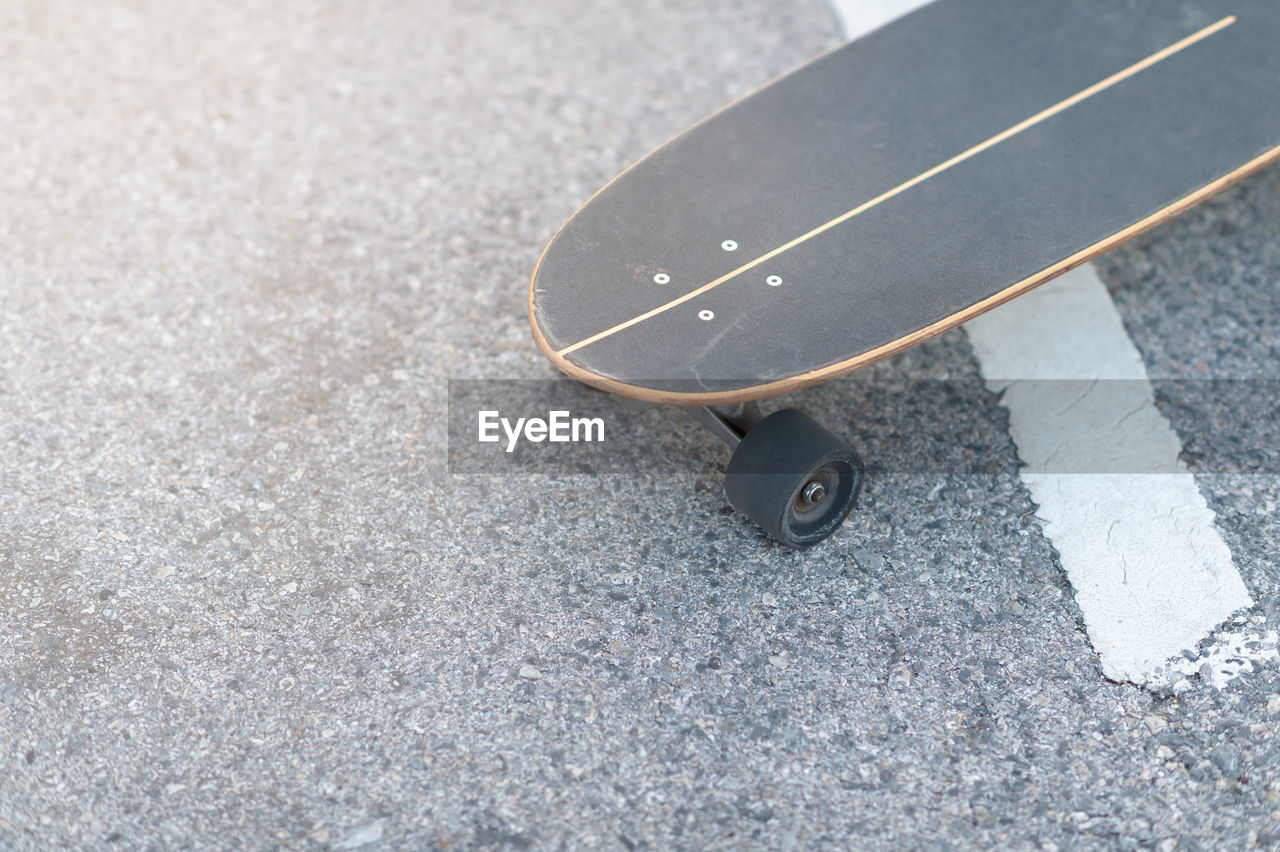 High angle view of skateboard on road